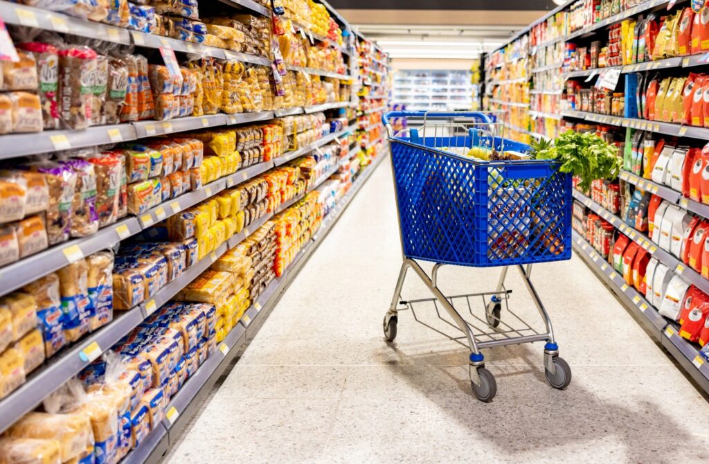 Shopping cart in the aisle of a supermarket