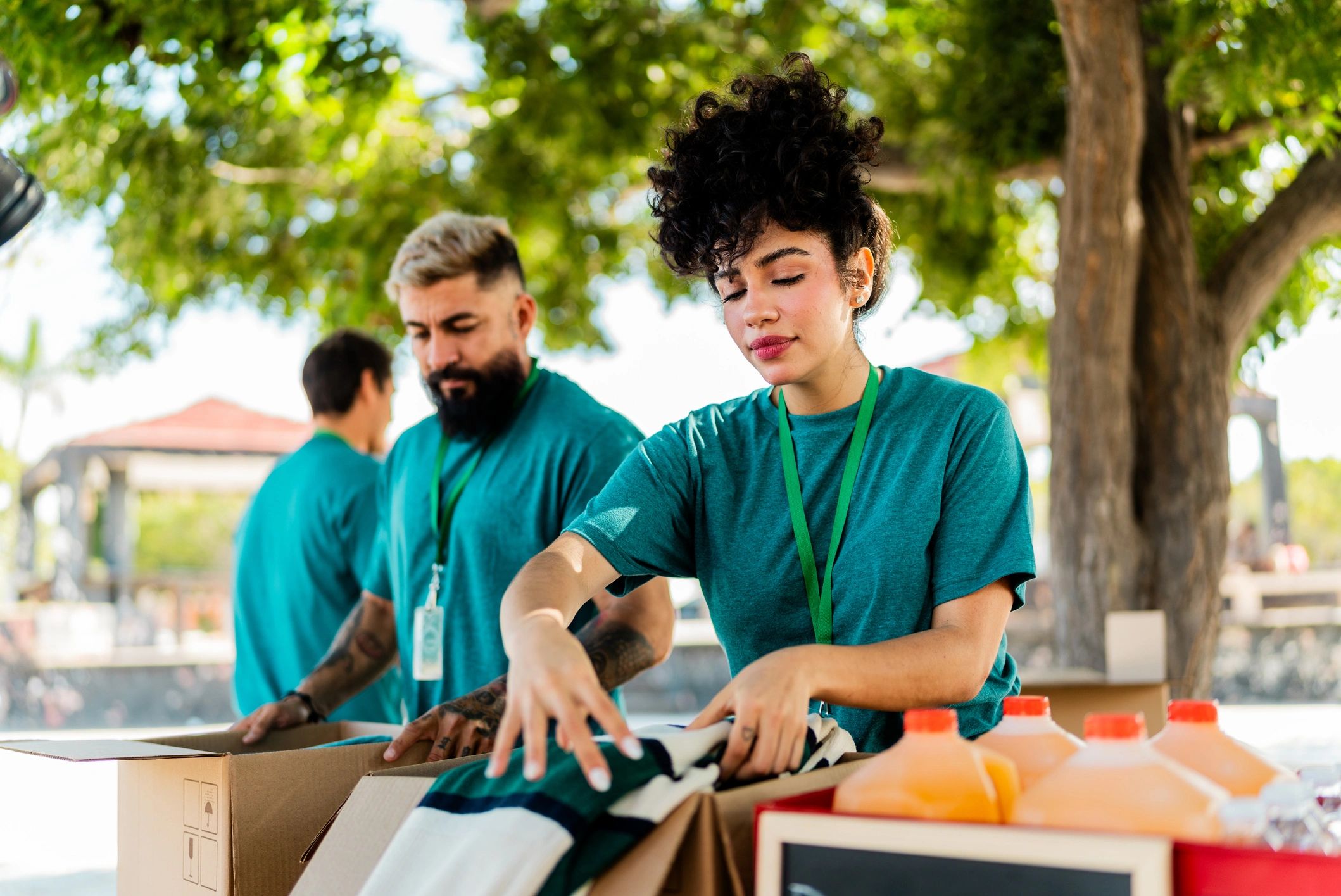 Volunteers organizing donated food boxes for distribution
